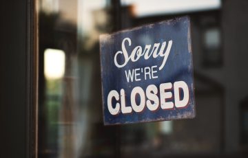 blue and white sorry we re closed wooden signage