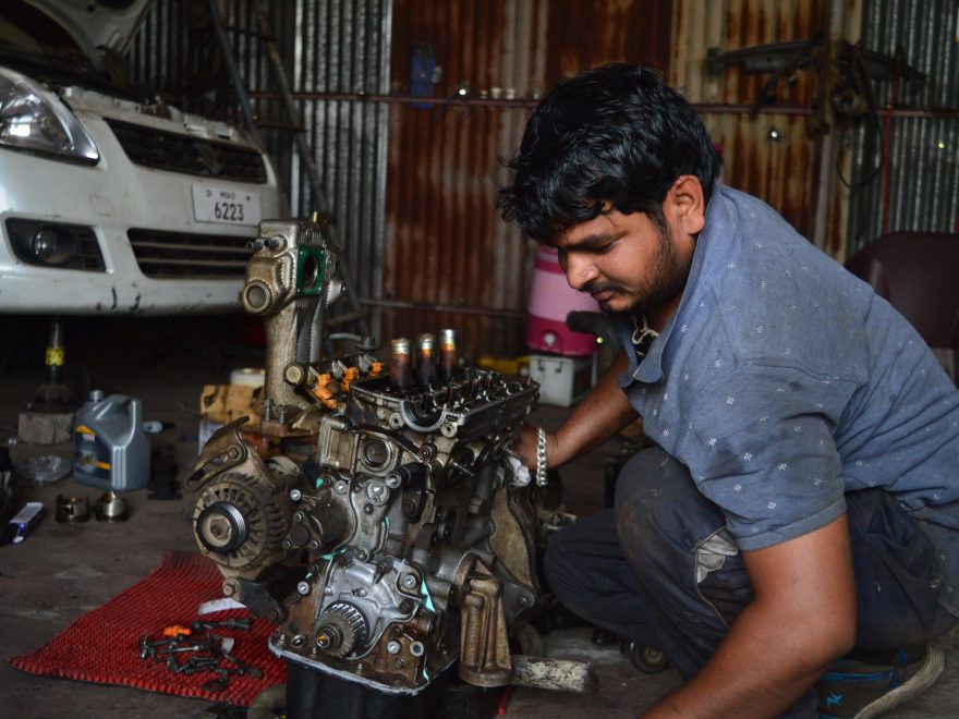 mechanic fixing an engine