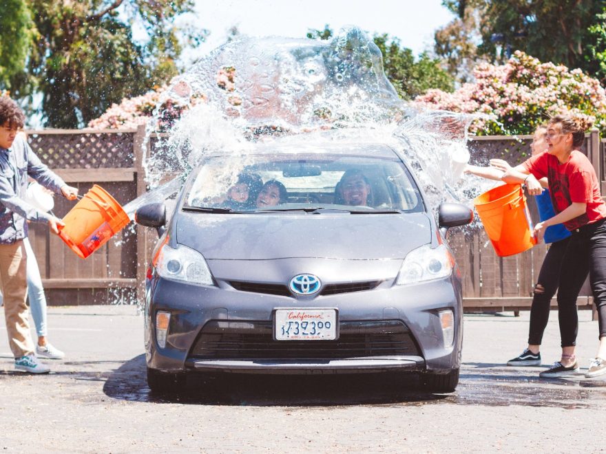 four children washing silver toyota prius