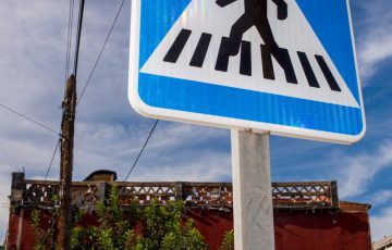 pedestrian crossing sign on urban street